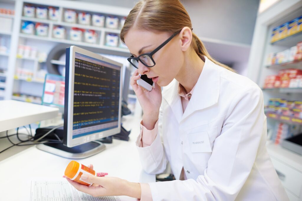 Female pharmacist advising by the phone call